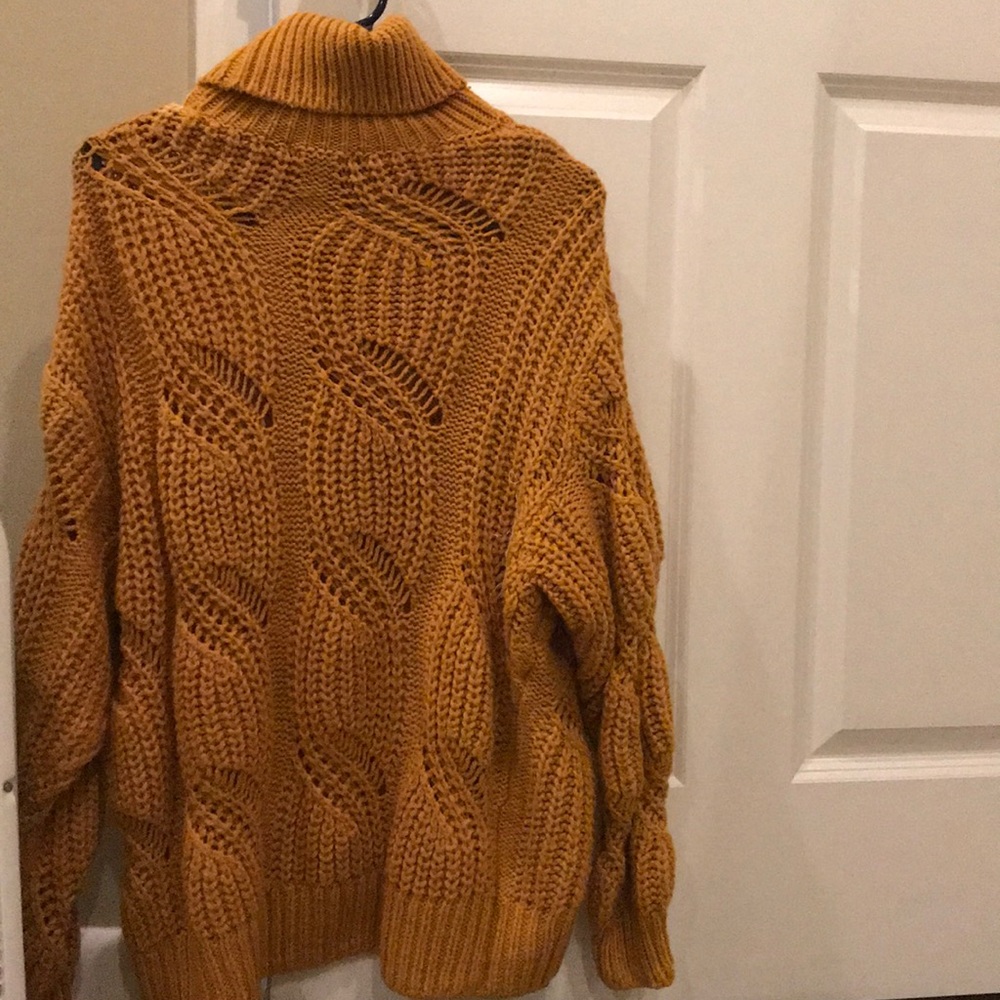 Mustard yellow sweater.